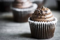 Chocolate cupcakes in cases — Stock Photo
