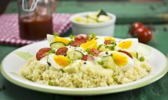 Egg ragout on bed of couscous — Stock Photo
