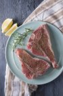 Two seasoned veal chops — Stock Photo