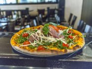 Pizza with Parma ham — Stock Photo