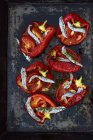 Piedmont-style stuffed peppers on black surface — Stock Photo