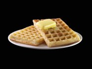 Waffles with knob of melting butter — Stock Photo