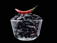 Black beans and red chilli — Stock Photo