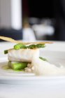 Sea bass with asparagus and crab foam — Stock Photo