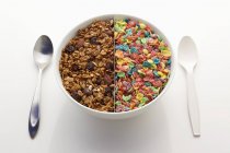 Bowl divided in two parts with muesli — Stock Photo