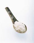 Spoon full of uncooked rice — Stock Photo
