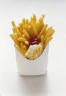 French fries with ketchup and mayonnaise — Stock Photo