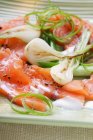 Salmon carpaccio with onions — Stock Photo