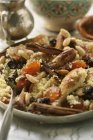 Couscous with chicken and dried fruit — Stock Photo