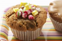 Baked Muffin with candies — Stock Photo
