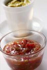 Pepper relish in small bowl, mustard relish behind it — Stock Photo