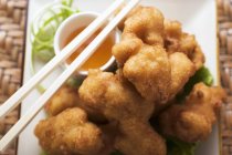 Asian chicken nuggets with apricot sauce — Stock Photo