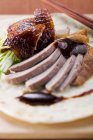 Sliced Peking duck with herb — Stock Photo