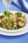 Salad leaves with mustard dressing and shrimps — Stock Photo