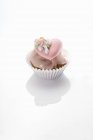 Cupcake with pink icing — Stock Photo