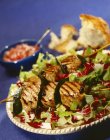 Grilled scallop kebabs and salads — Stock Photo
