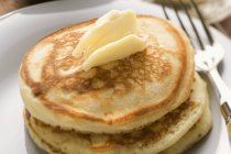Pancakes with dab of butter — Stock Photo