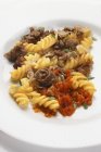 Fusilli pasta with meat and tomato sauce — Stock Photo