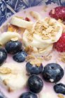 Muesli with berries and banana — Stock Photo