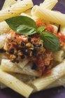 Rigatoni pasta with tomato and aubergine sauce — Stock Photo