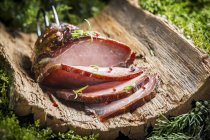 Sliced Smoked ham with herbs — Stock Photo