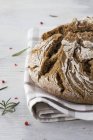 Country bread on cloth — Stock Photo