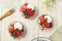 Strawberry tartlets with blueberries — Stock Photo