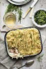 Fish pie with dill and peas — Stock Photo