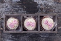 Cupcake with pink fondant — Stock Photo