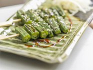 Okra skewers with seeds — Stock Photo