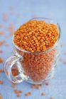 Red lentils in jug — Stock Photo