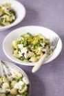 Orecchiette pasta with green peas — Stock Photo