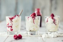 Closeup view of Eton Mess with raspberries in glasses — Stock Photo