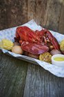Cooked lobster with corn — Stock Photo