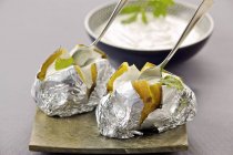 Baked potatoes with sour cream dip — Stock Photo