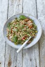 Farro salad with raw vegetables on plate — Stock Photo
