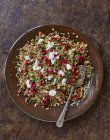 Freekah salad with pomegranate syrup and ricotta — Stock Photo