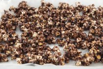 Chocolate popcorn on tray — Stock Photo