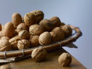 Walnuts in wooden basket .jpg — Stock Photo