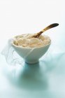 Bowl of ricotta with spoon — Stock Photo
