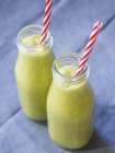 Bottels of green smoothie — Stock Photo