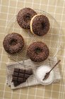 Chocolate-glazed doughnuts — Stock Photo