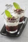 Closeup view of sweet Verrine with cherries and mint leaves — Stock Photo