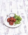 Beetroot falafel with yoghurt — Stock Photo