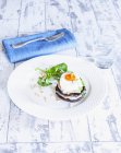 Stack of poached egg and salmon — Stock Photo