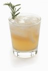 Cocktail with ice and rosemary — Stock Photo