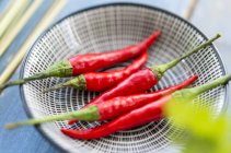 Red chilli peppers on bowl — Stock Photo