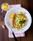 Potato salad with sausage and mustard — Stock Photo