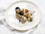 Turbot with truffles and chanterelle mushrooms — Stock Photo