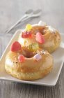 Doughnuts decorated with sweets — Stock Photo